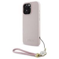 Guess Grained Back Cover MagSafe mit Flower Charm Strap für das iPhone 16 Pro - Rosa